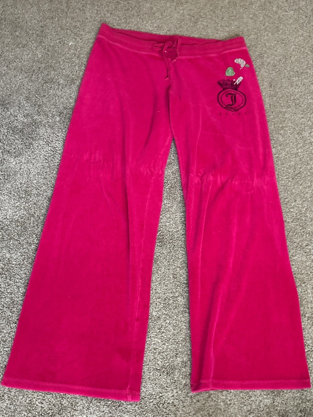 Juicy Couture pink velour sweatpants with rhinestone logo and drawstring waist.